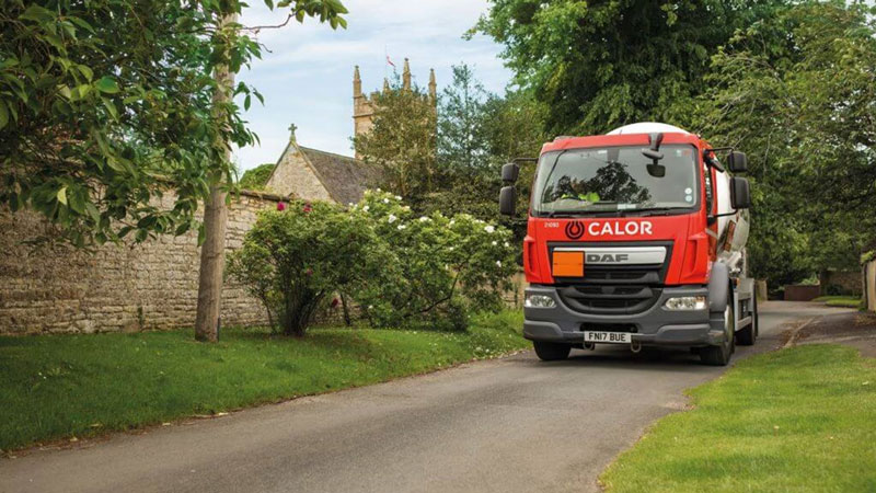 Calor truck driving down a county road