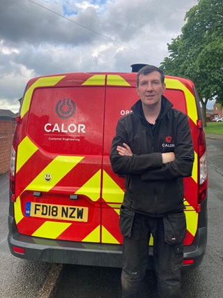 Calor Engineer standing in front of a Calor van