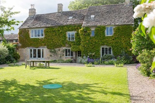 An LPG underground tank cover in the garden of a rural cottage