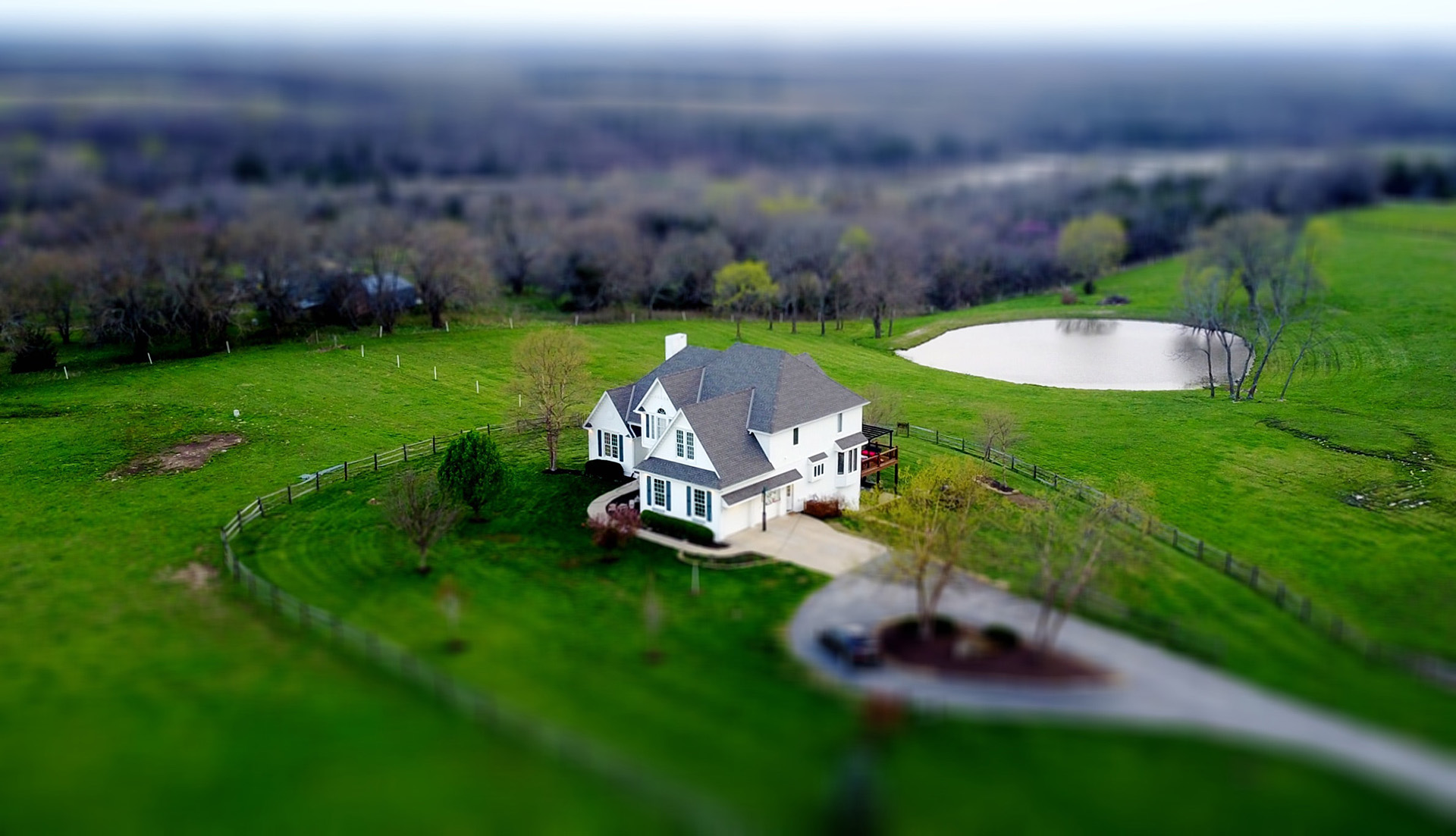 A large white house in the countryside 