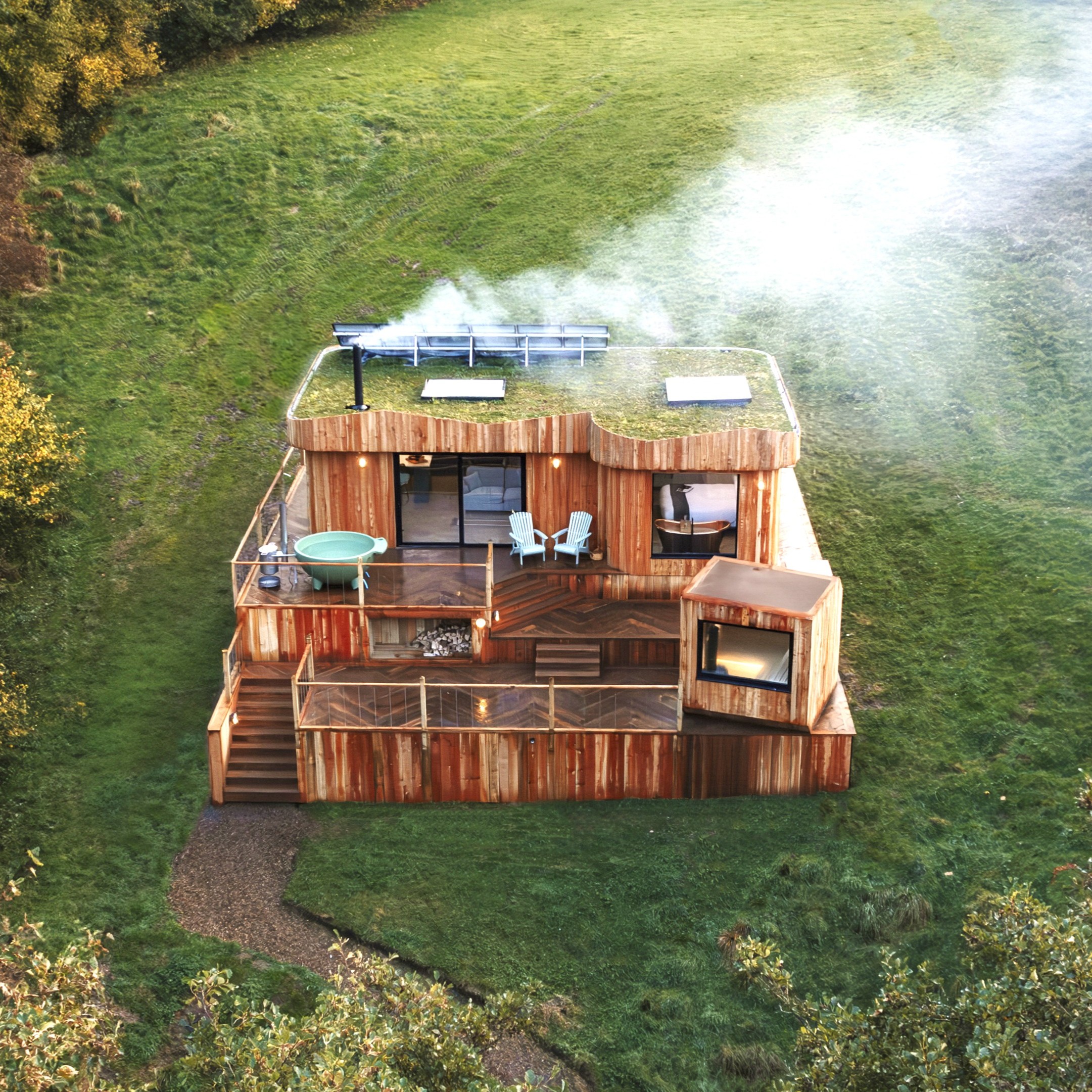 Aerial shot of a cabin at the fold with a cloud of steam powered by Calor BioLPG