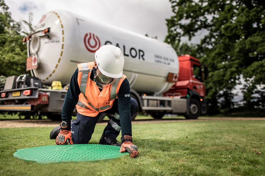 Calor engineer attending to a below ground tank