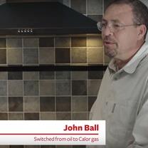 One of Calor’s customers is standing in his kitchen, sharing his experiences with Calor.